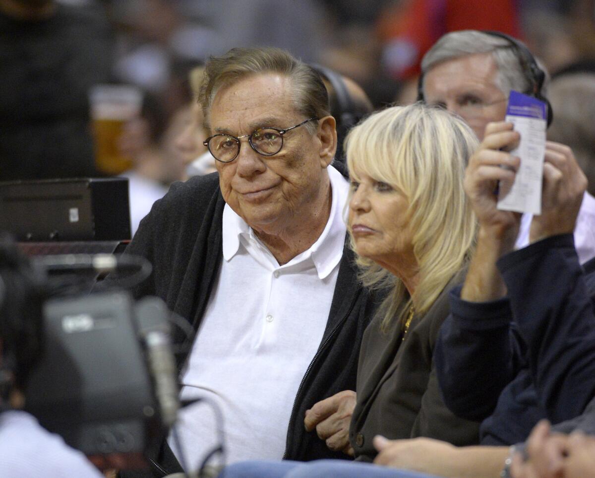 Then-Clippers owners Donald Sterling and his wife Shelly Sterling watch the team play the Spurs on Nov. 7, 2012.