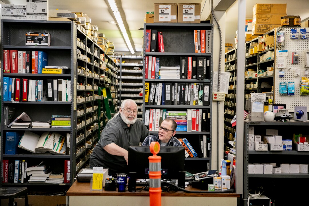 Frank May, 66, and Gene Anderson, 62, work alongside one another in the San Diego Electric store.