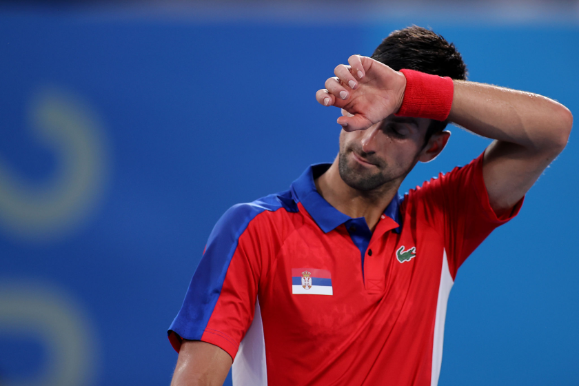 TOKYO, JAPAN - JULY 30: Novak Djokovic of Team Serbia wipes away sweat.
