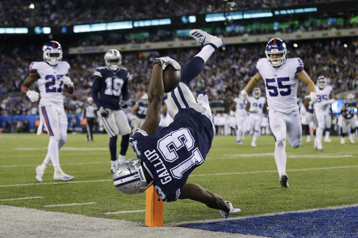Cowboys receiver Michael Gallup flips over the goal line for a touchdown against the Giants during the fourth quarter of a game at MetLife Stadium.