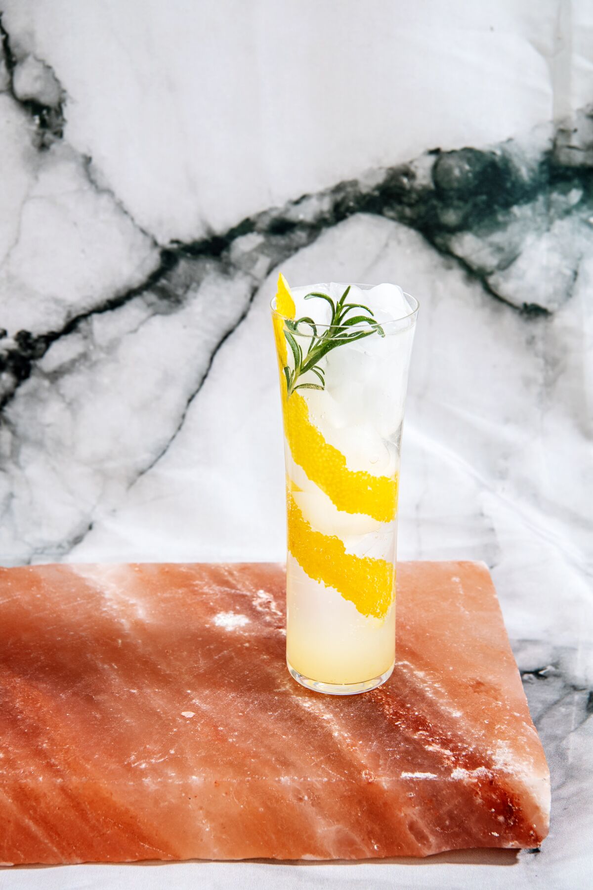 Garnish the drink with a rosemary sprig for extra freshness.