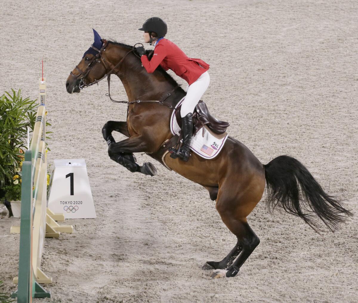 Jessica Springsteen's horse prepares to leap an obstacle.