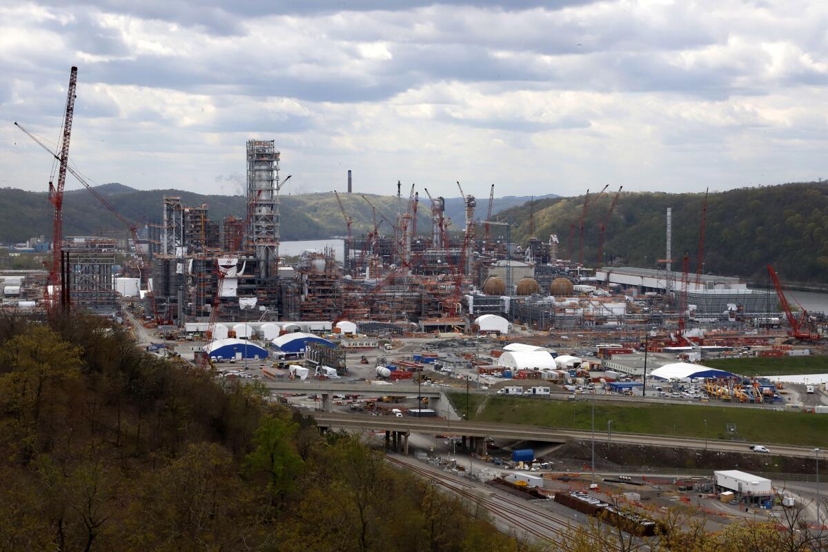 FILE — In this May 12, 2020 file photo, construction is seen on the Shell Chemicals Beaver County ethane cracker plant in Potter Township, Pa. Years in the works, a massive petrochemical refinery in western Pennsylvania fed by the vast natural gas reservoir underneath Appalachia became fully operational Tuesday, oil and gas giant Shell plc said. (AP Photo/Gene J. Puskar, File)