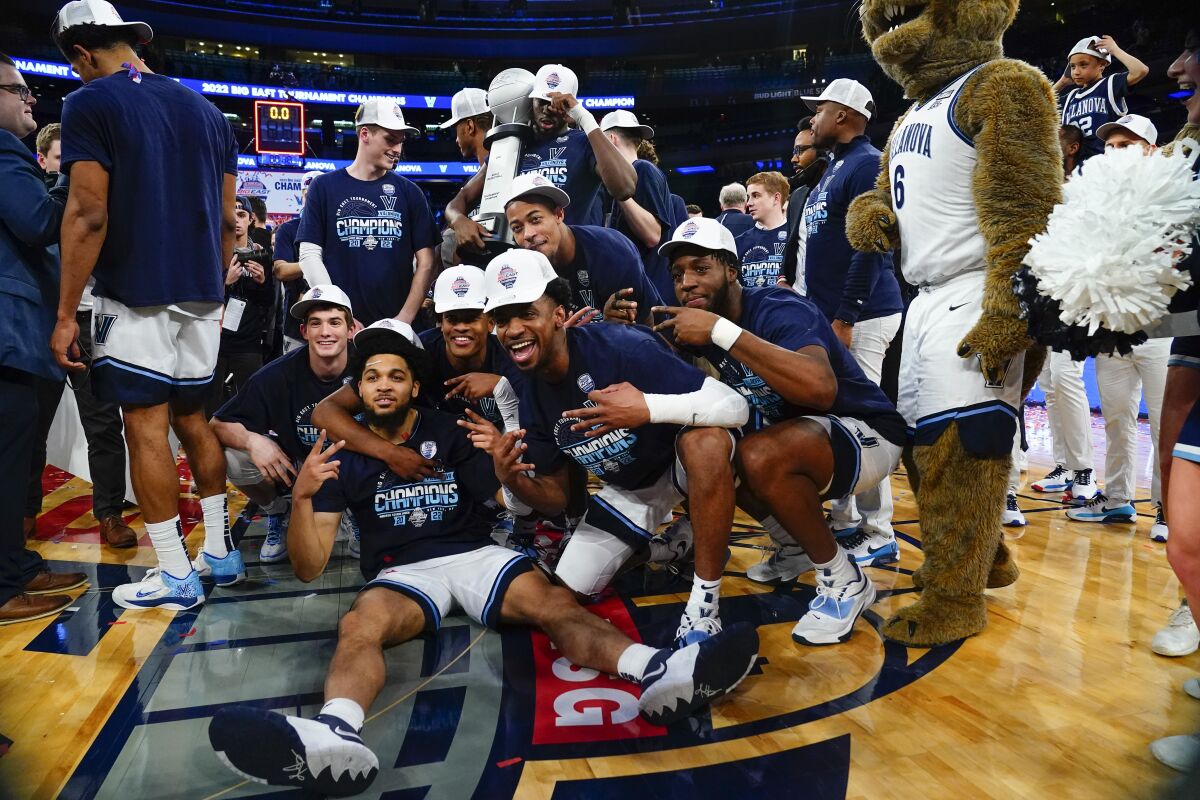 Villanova players celebrate after defeating Creighton in the Big East tournament final on March 12.