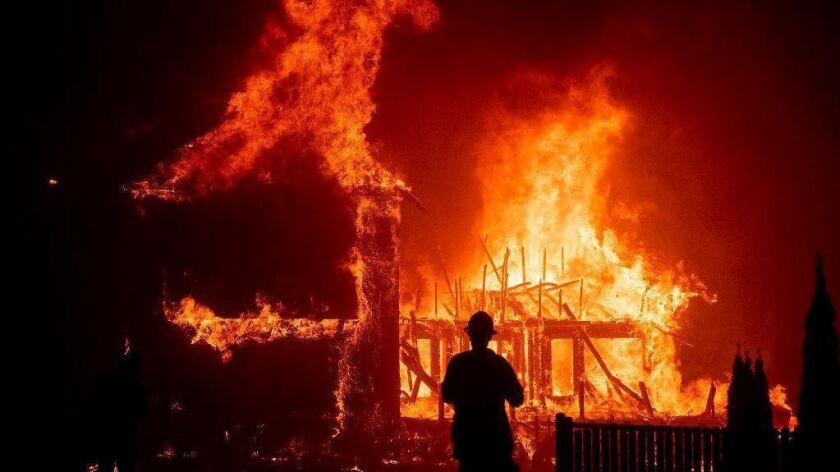 A home burns as the Camp fire rages through Paradise, Calif., on Nov. 8, 2018.