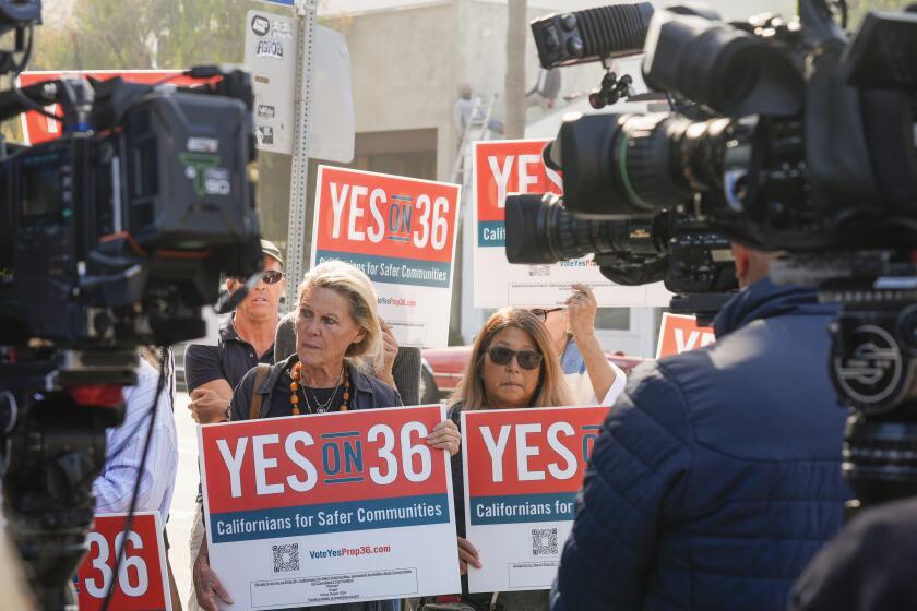 Neighbors and local business owners join in to support California's Proposition 36 on the November ballot at a news conference in the Venice neighborhood of Los Angeles on Monday, Sept. 30, 2024. (AP Photo/Damian Dovarganes)