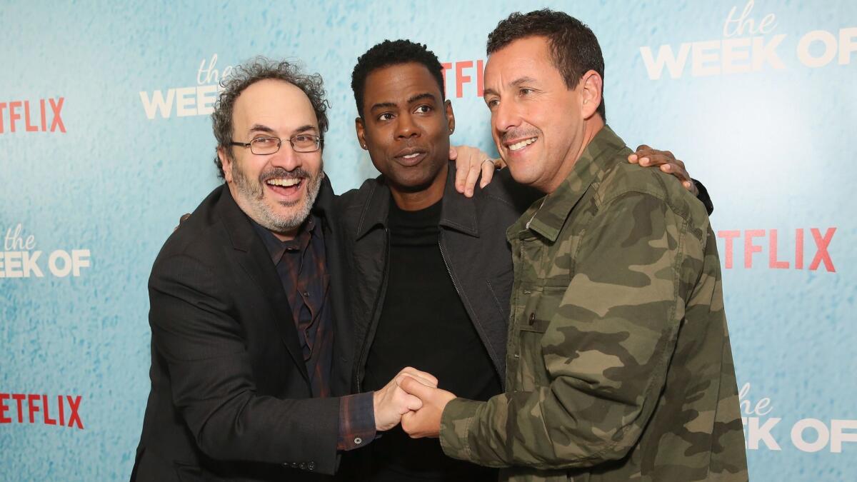 Robert Smigel, left, Chris Rock and Adam Sandler attend the world premiere of the Netflix film "The Week Of" on April 23 in New York City.