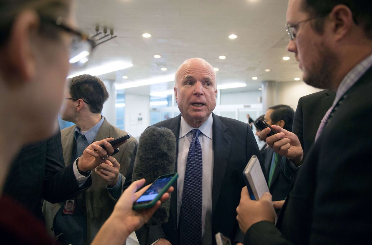 Sen. John McCain speaks to reporters about the release of a report on CIA interrogations Tuesday.
