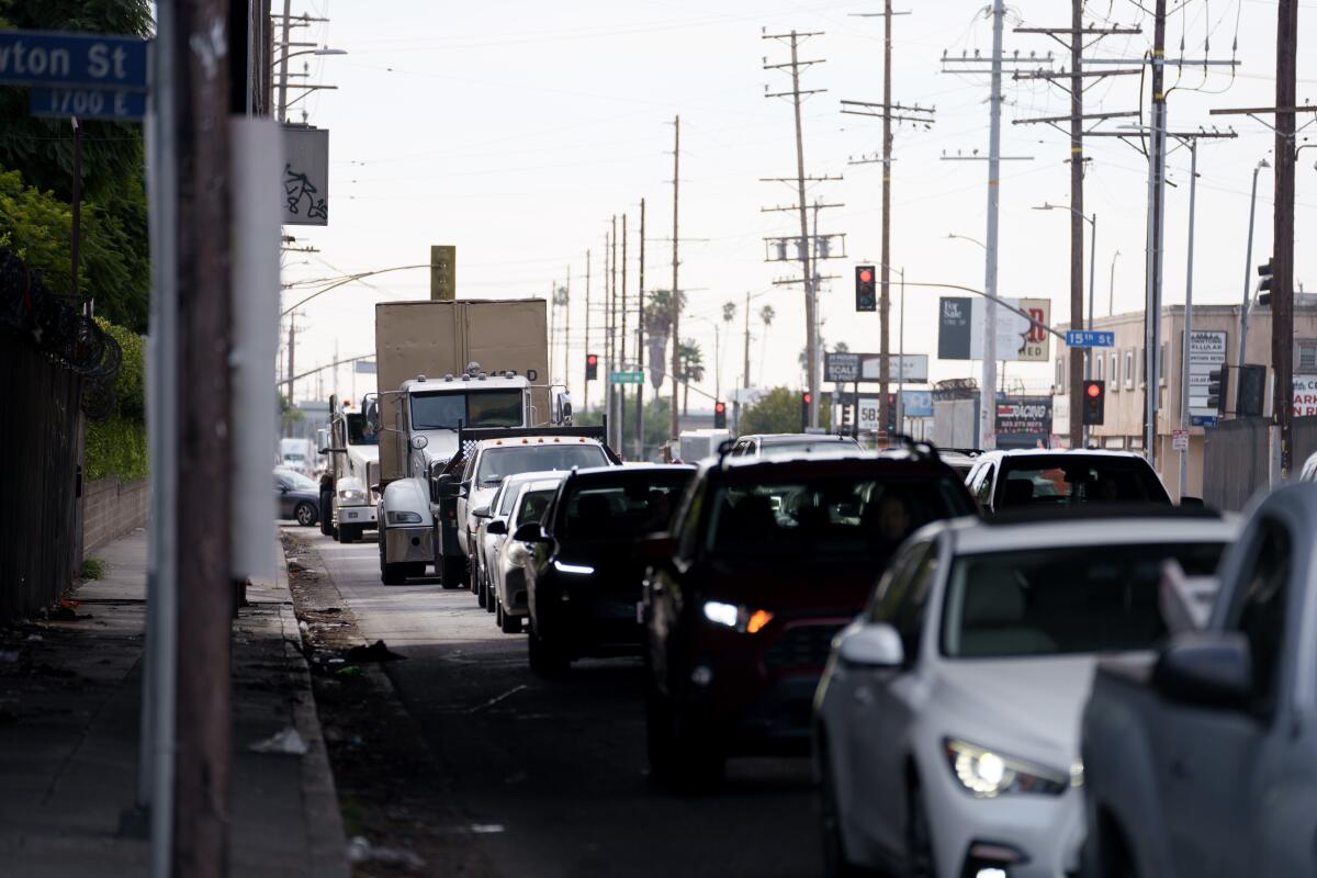Car traffic crawls on the street near the site of a fire that shut down the 10 Freeway in Los Angeles on Nov. 13. 
