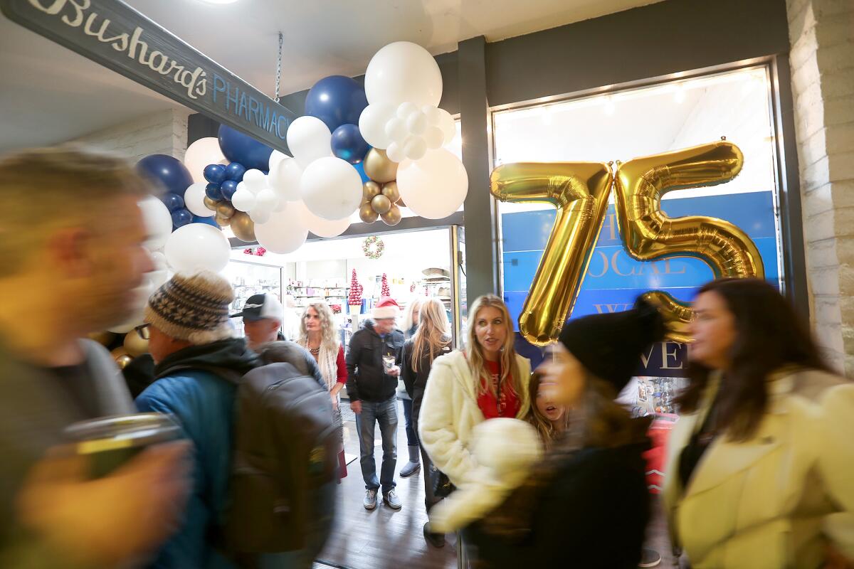 Bushard's Pharmacy displays a 75 balloon to mark its 75th anniversary celebration.