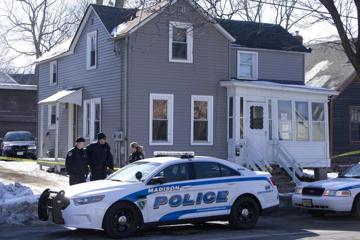Madison, Wis., police investigate the scene of a police shooting late Friday at a home.