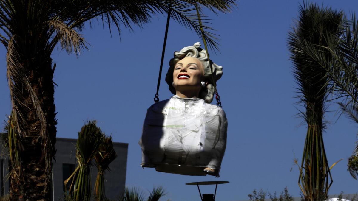 Marilyn Monroe Statue Sports Survivor Buff To Celebrate Season 45