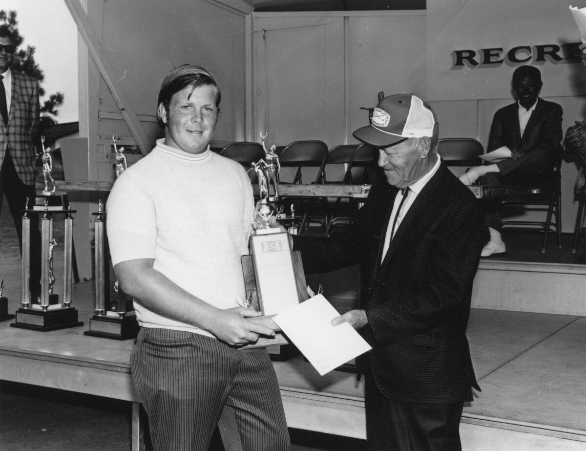 1970 Junior World 15-17 champion Craig Stadler (left) with John Brown.