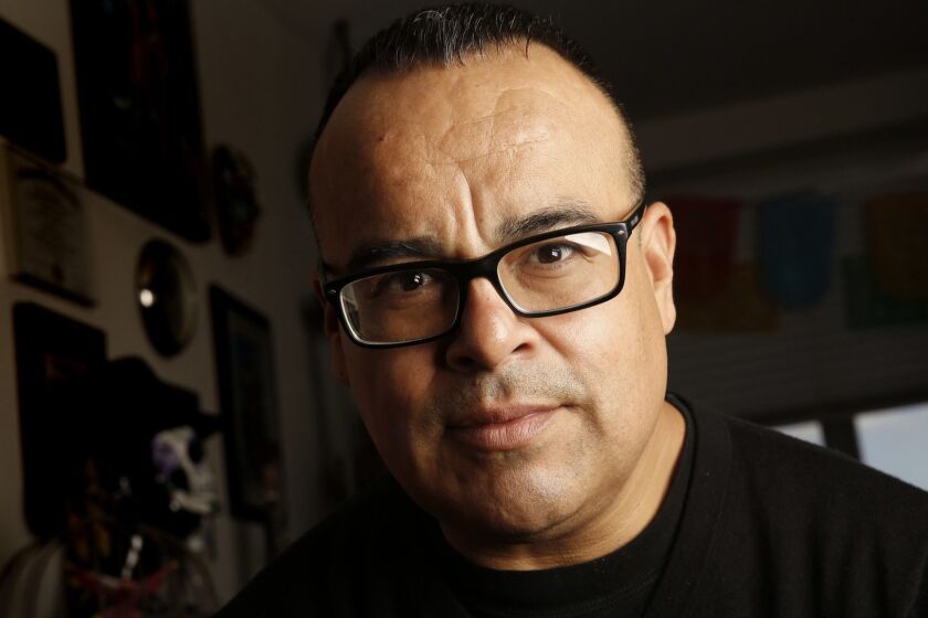 QUEENS, NEW YORK--APRIL 19, 2016-Rigoberto Gonzalez is a poet and author, one of the Los Angeles Times critics at large. Photographed at his home in Queens, New York on April 19, 2016. (Carolyn Cole/Los Angeles Times)