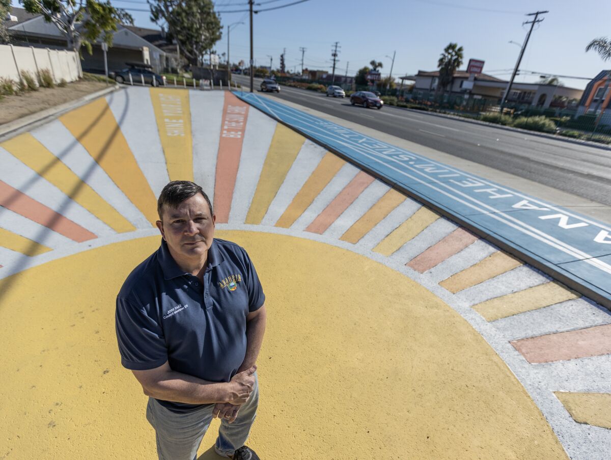 Anaheim City Councilmember Jose Diaz stands on a painted walkway next to Beach Boulevard.