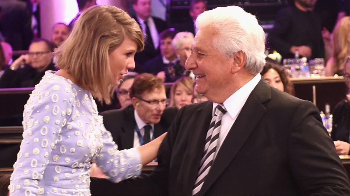 Taylor Swift and Sony/ATV Music Publishing Chief Executive Martin Bandier at the Pre-Grammy Gala and Salute to Industry Icons honoring Bandier at the Beverly Hilton Hotel on Feb. 7, 2015, in Beverly Hills. (Photo by Larry Busacca/Getty Images)