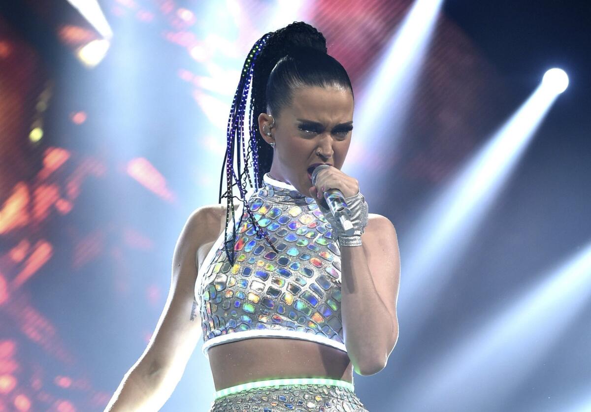 In this Sept. 16, 2014, file photo, Katy Perry performs onstage during the Prismatic World Tour at the Honda Center in Anaheim. Perry will team with Lenny Kravitz at the Super Bowl.