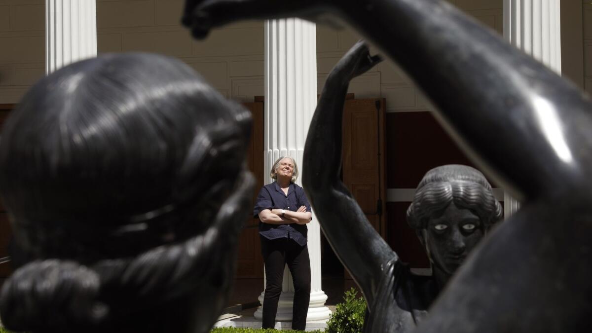 Anne Bogart, photographed near statues representing the female devotees of Bacchus, the Roman god of wine, at the Getty Villa in Pacific Palisades.