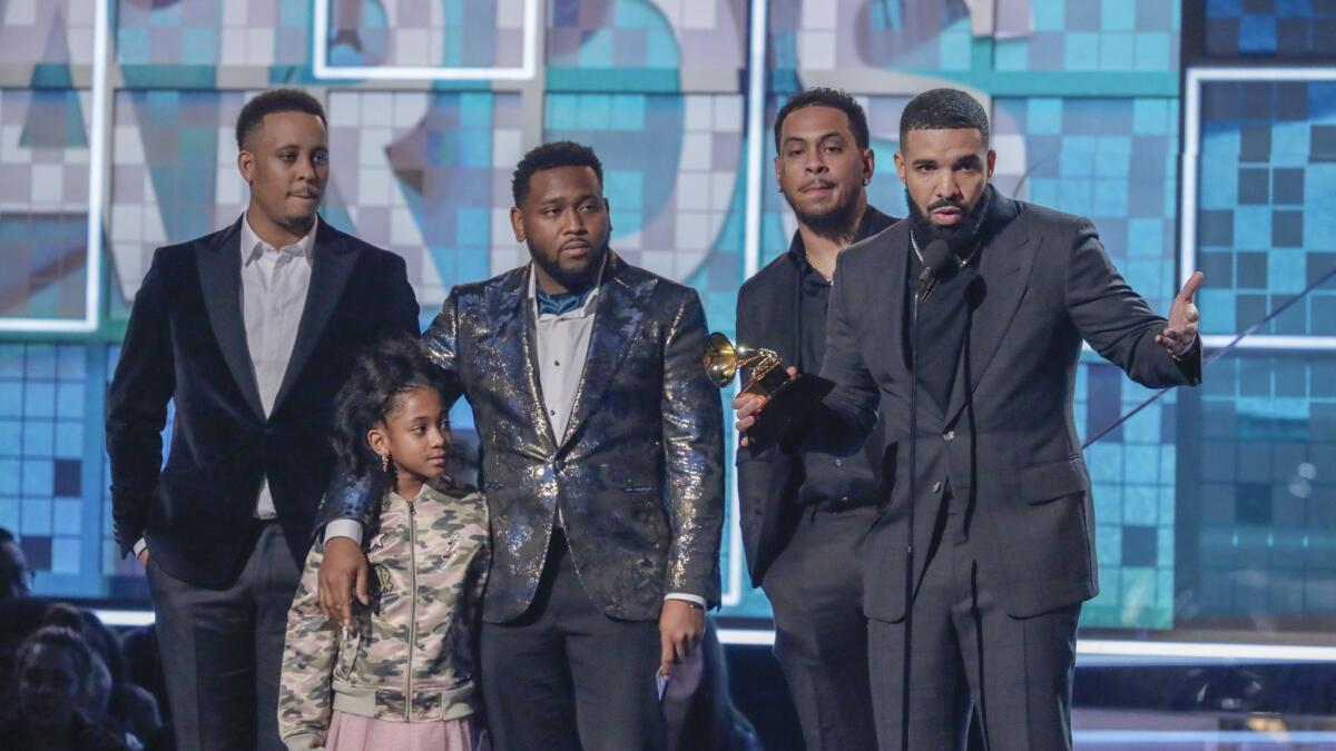 Rapper Drake accepts the award for rap song for "God's Plan" at Sunday's Grammy Awards. He was bypassed once again in the album of the year category.