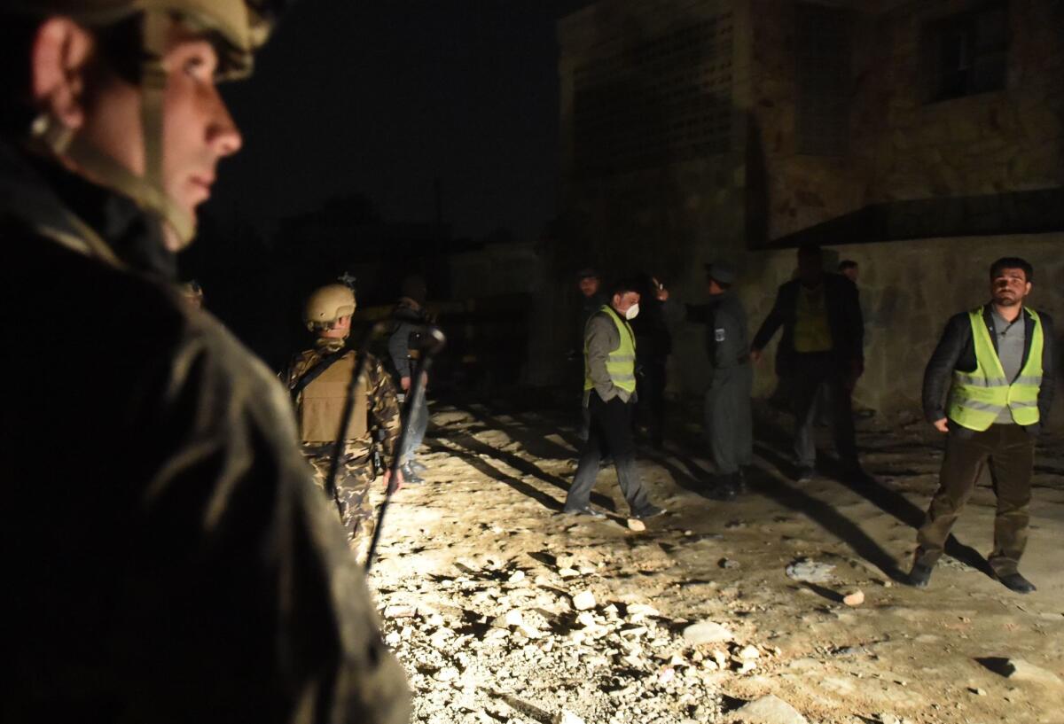Afghan security officials arrive at the site of a bomb attack at the French restaurant Le Jardin in Kabul on Friday. The Taliban claimed responisibility for the attack that killed two and wounded 15.