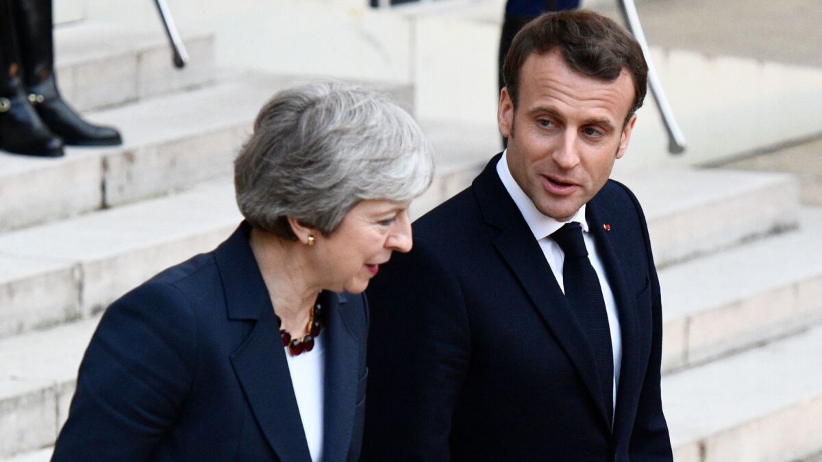French President Emmanuel Macron and British Prime Minister Theresa May after a meeting at the Elysee Palace in Paris on April 9, 2019.