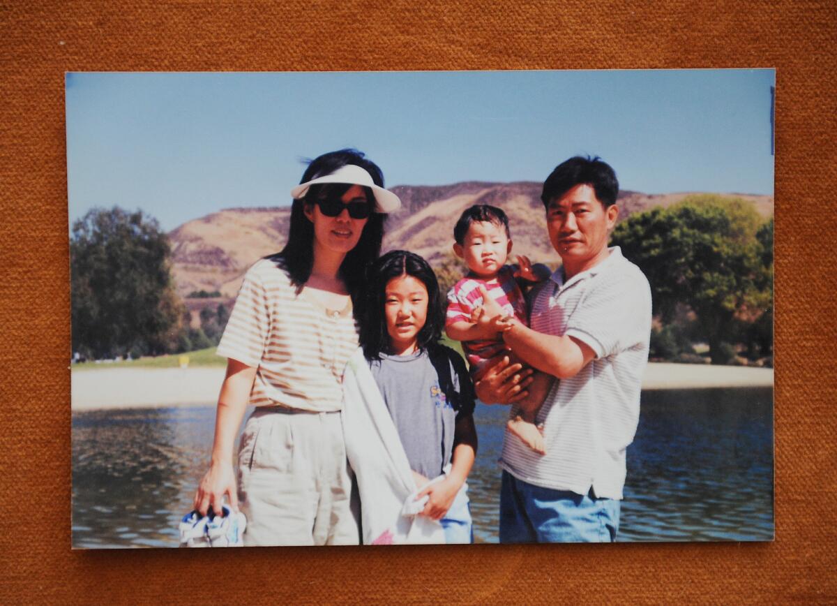 Binna Kim, second from left, in a photograph with her parents and her younger brother.