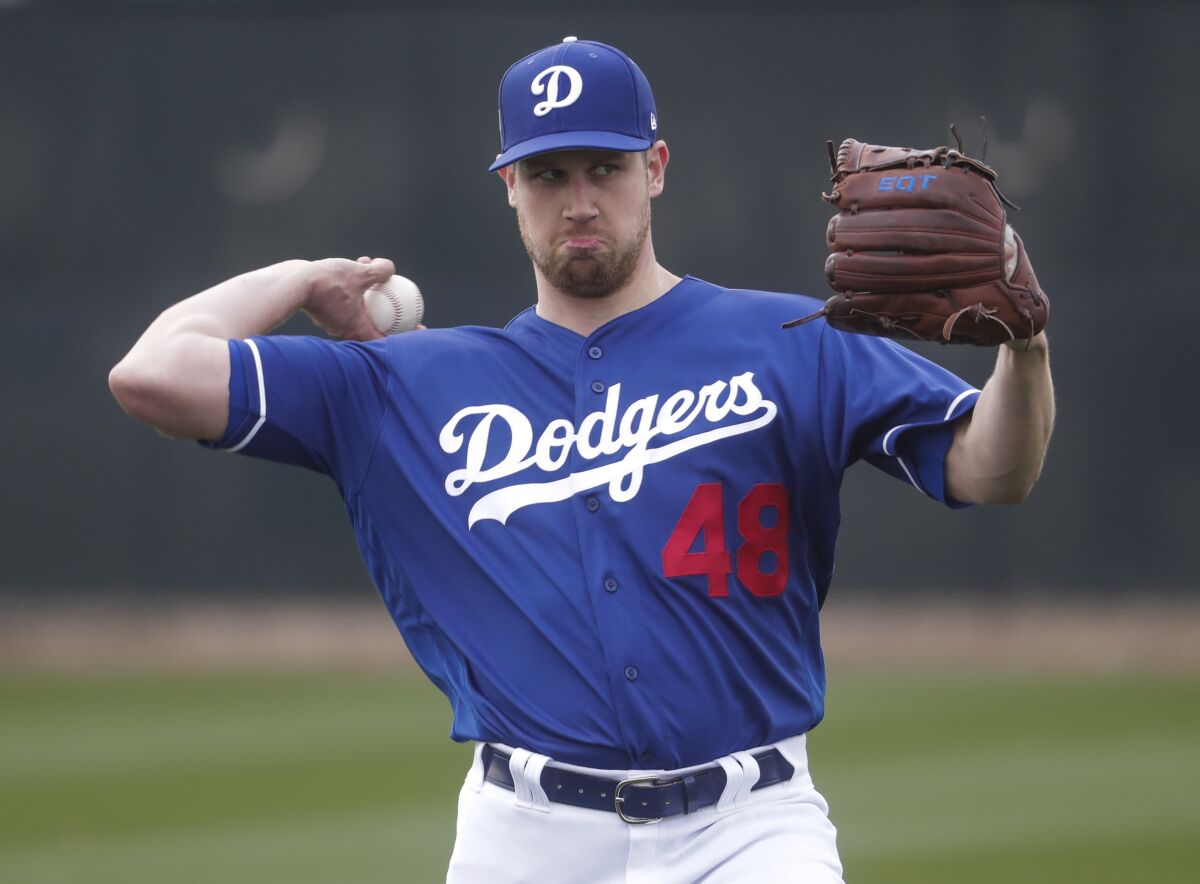 Dodgers pitcher Brock Stewart throws during a spring training baseball workout in February 2019.