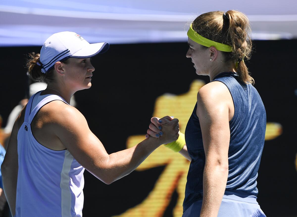 Ash Barty congratulates Karolina Muchova.