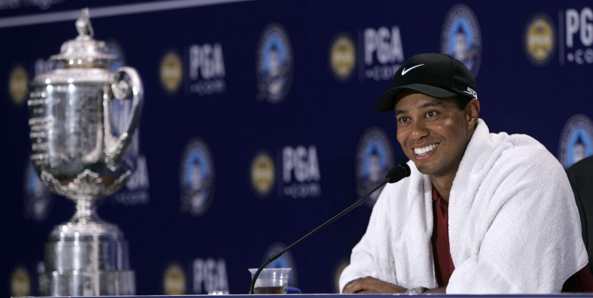 FILE - Tiger Woods sits next to the Wanamaker Trophy during a press conference following his win at the 89th PGA Championship golf tournament at the Southern Hills Country Club in Tulsa, Okla., Sunday, Aug. 12, 2007. Southern Hills is hosting the PGA this week for a record fifth time. (AP Photo/Morry Gash, File)