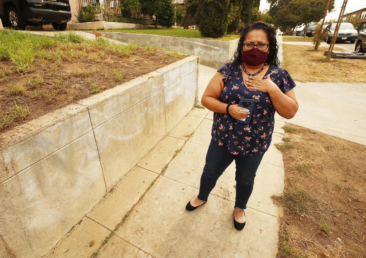 Terry Gonzalez-Cano, 48, speaks outside her Boyle Heights home.