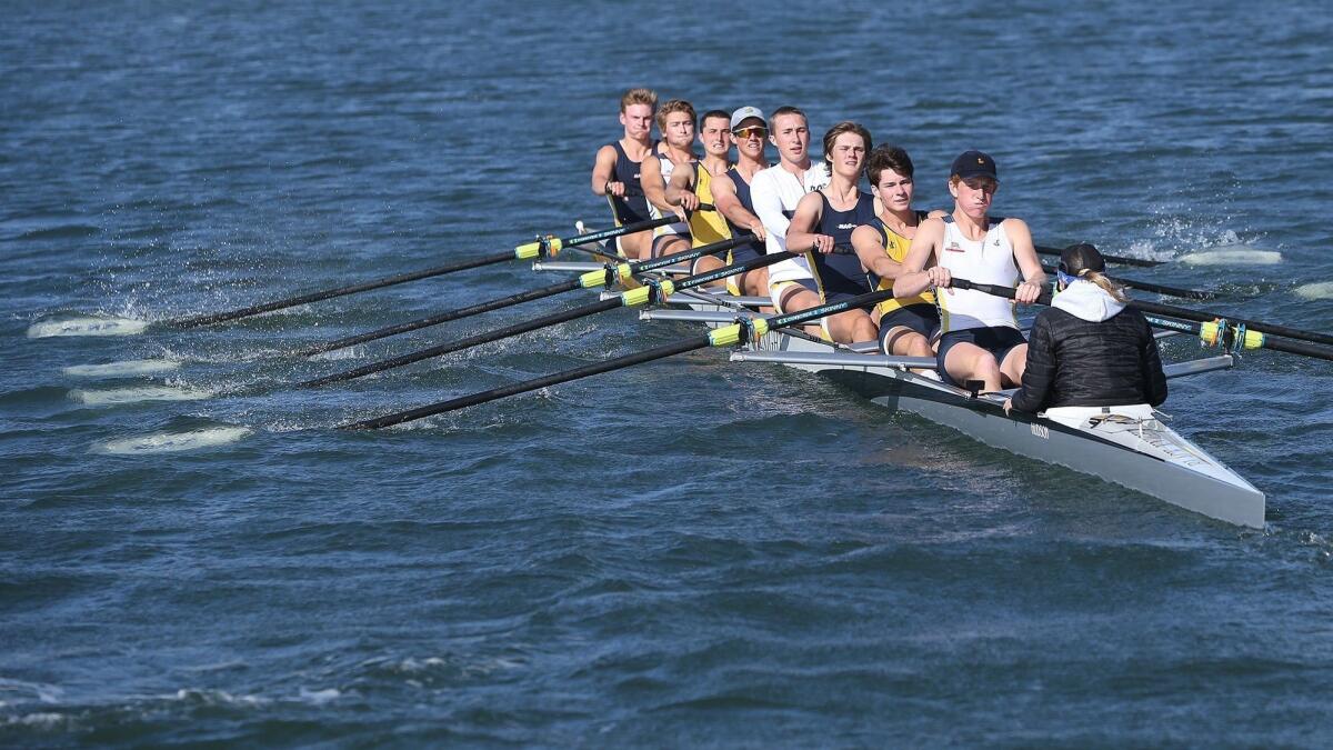 The Newport Aquatic Center varsity eight boat pulls through the Back Bay during a practice on April 16. The boys' team won the USRowing Southwest Youth Championship on May 6.