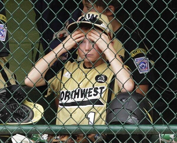 Connor Kieckbusch watches from the dugout as Billings, Mont., tries to rally from a big deficit during the sixth inning of the U.S. championship baseball game against Ocean View on Saturday at the Little League World Series.