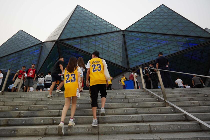 Fans wearing LeBron James shirts arrive to watch the National Basketball Association (NBA) pre-season game between the Los Angeles Lakers and Brooklyn Nets in Shenzhen, in China's southern Guangdong province on October 12, 2019. (Photo by STR / AFP) / China OUT (Photo by STR/AFP via Getty Images) ** OUTS - ELSENT, FPG, CM - OUTS * NM, PH, VA if sourced by CT, LA or MoD **