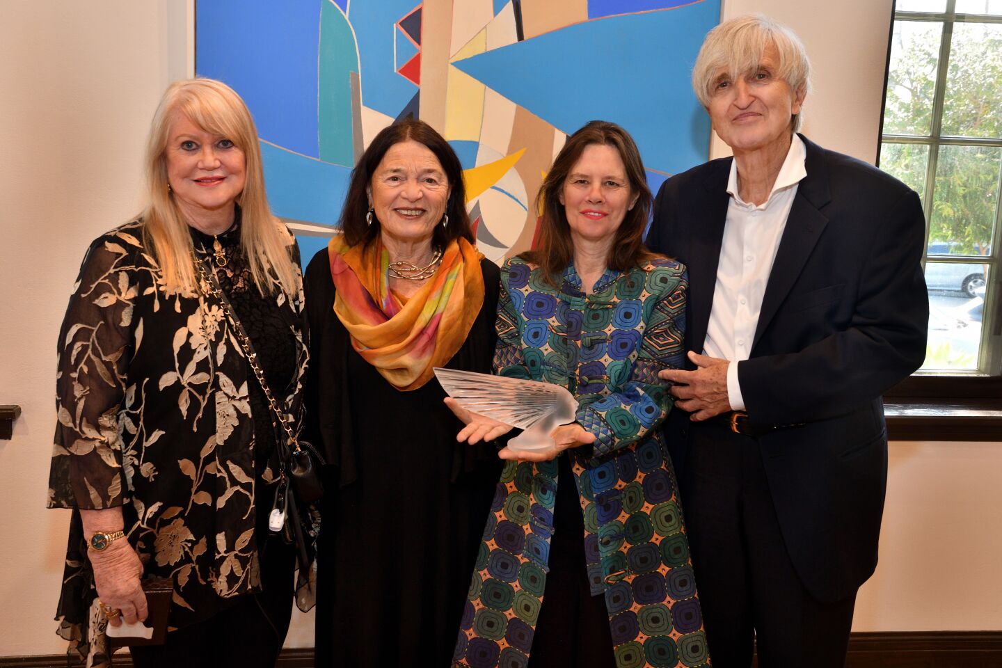 Diana Pickett of Charter 100 International; Erika Torri, executive director of the Athenaeum Music & Arts Library; and Francoise Gilot's daughter Aurelia Engel and her husband, Colas Engel, attend "Gilot 100," a private exhibit of Gilot's art April 24 at the Athenaeum.