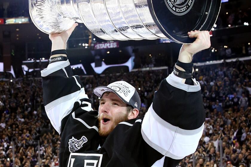 Kings goalie Jonathan Quick celebrates following the team's Stanley Cup victory over the New York Rangers on June 13. Quick underwent wrist surgery Tuesday and is expected to be out for three months.