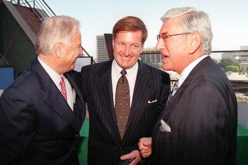 In a 1997 photo, Los Angeles Mayor Richard Riordan, left, talks with Ron Burkle, center, and Eli Broad after a $15-million gift was donated to the Walt Disney Concert Hall project.