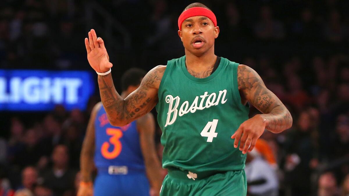 Celtics guard Isaiah Thomas reacts after making a three-point shot against the Knicks on Sunday.