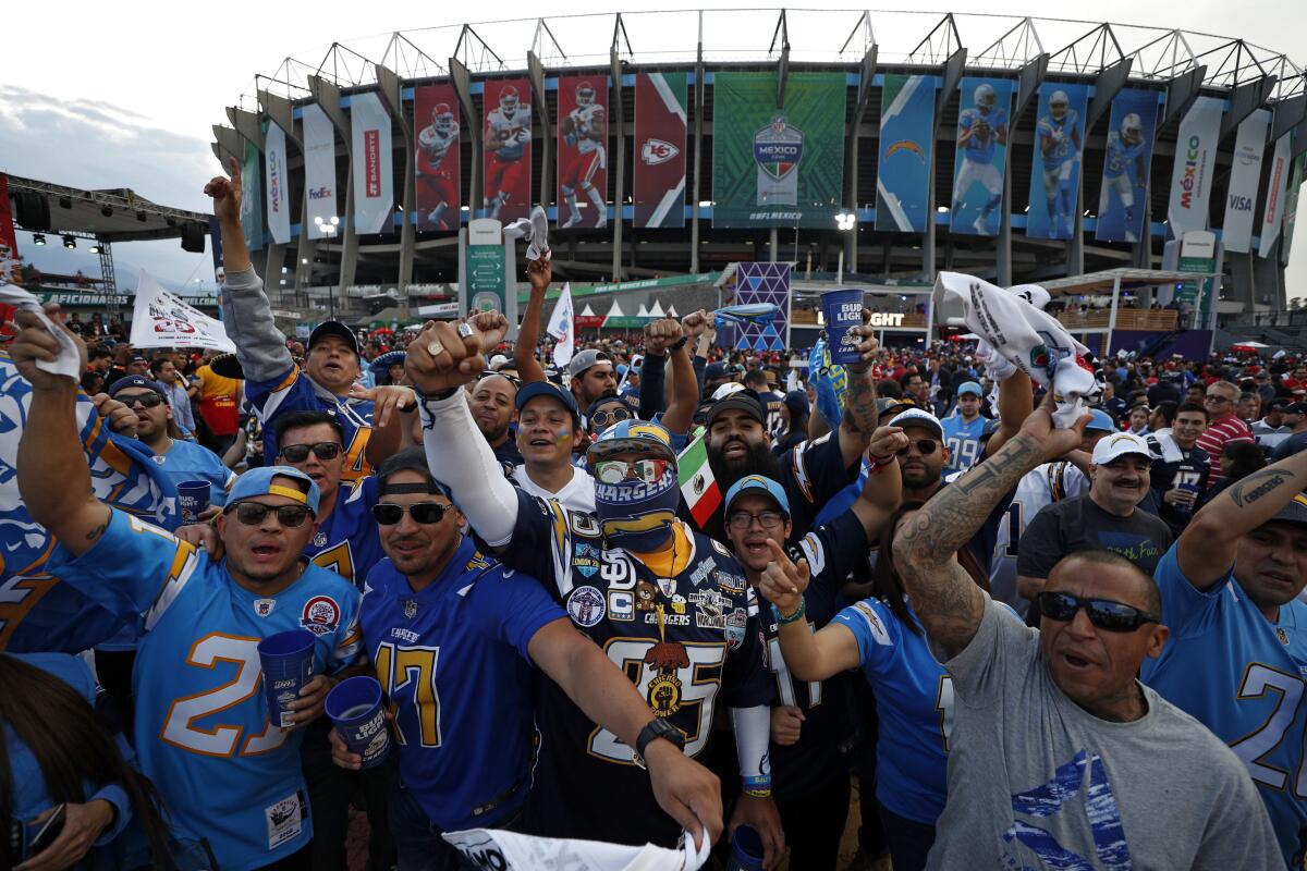 Fans cheer before Monday's NFL game between the Chargers and the Kansas City Chiefs at Aztec Stadium in Mexico City.