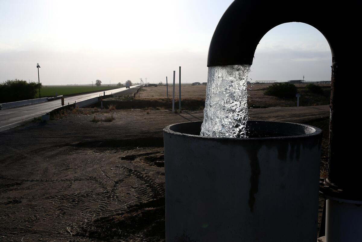 Well water is pumped from the ground in Tulare, Calif., in April.