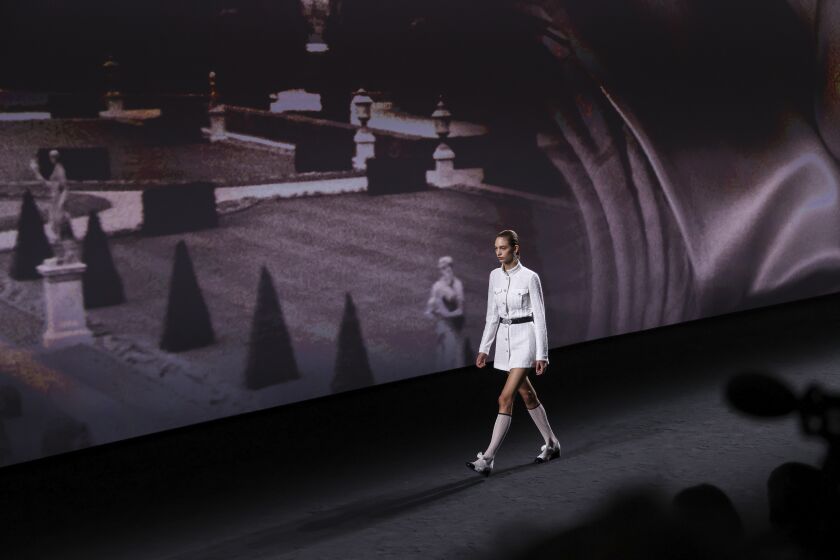 A model wears a creation for the Chanel ready-to-wear Spring/Summer 2023 fashion collection presented Tuesday, Oct. 4, 2022 in Paris. (Photo by Vianney Le Caer/Invision/AP)