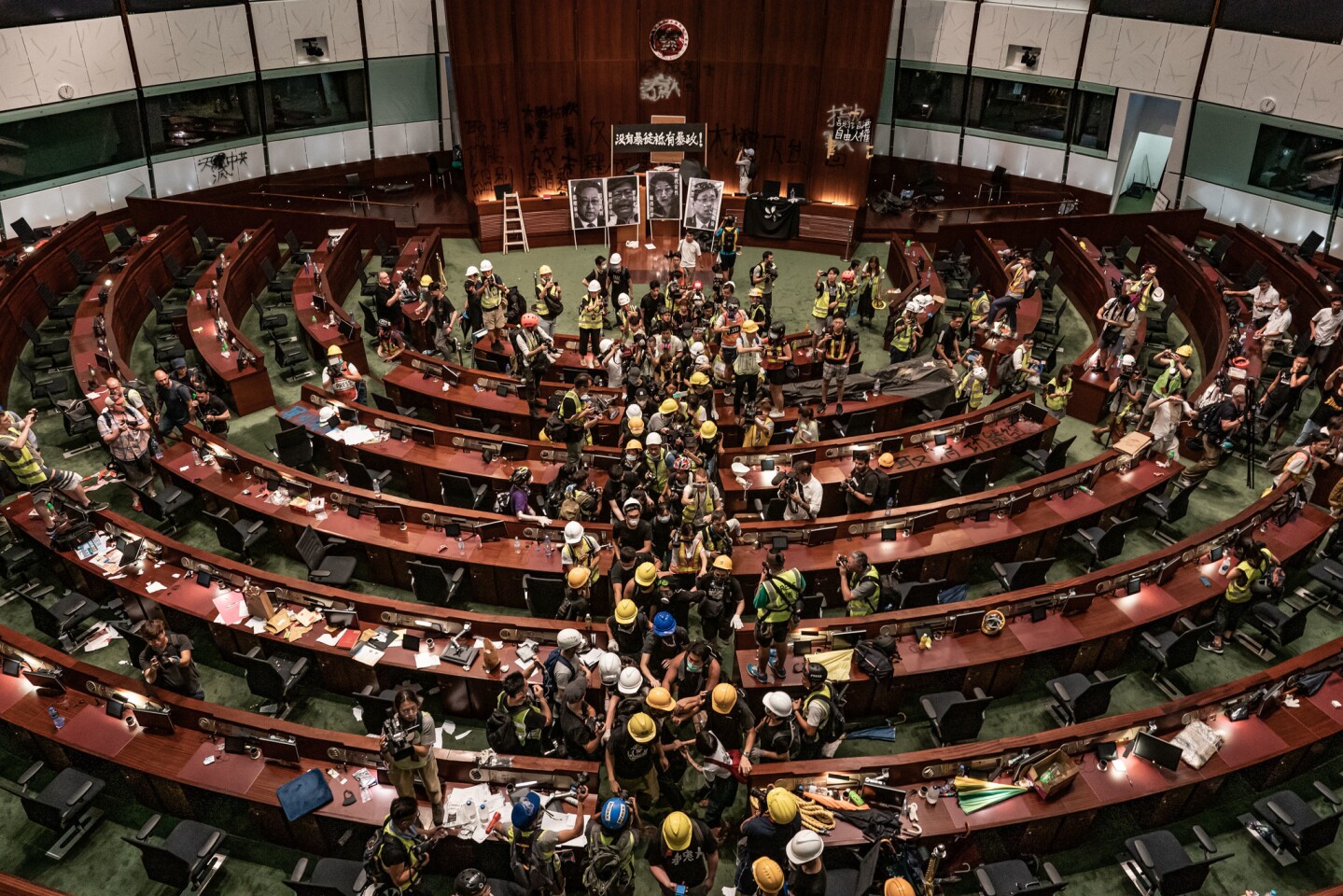 Protesters leave the parliament chamber of the government headquarters on July 1, 2019, in Hong Kong. Thousands of pro-democracy protesters faced off with riot police on July 1, during the 22nd anniversary of Hong Kong's return to Chinese rule.