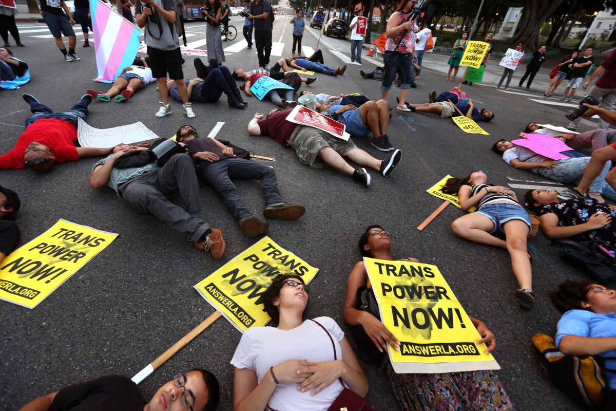 LGBTQ activists and community leaders lie in the intersection of 1st and Main streets in Los Angeles in August to protest violence against transgender and "gender-nonconforming" people.
