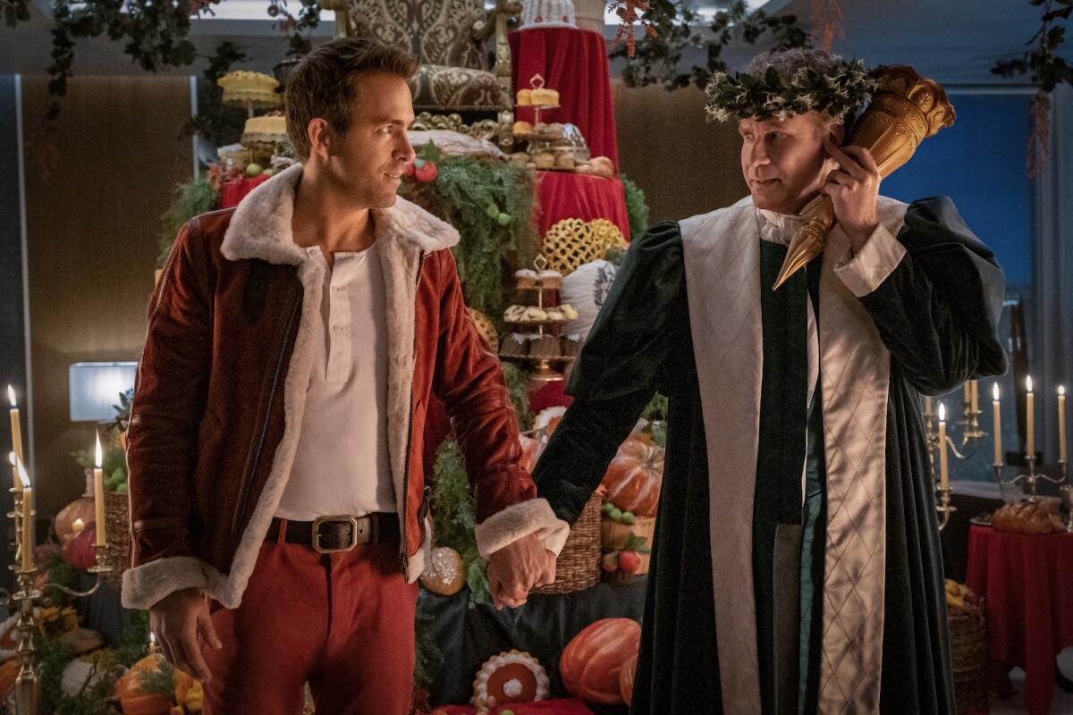 Spirited Review Will Ferrell Ryan Reynolds Form Holiday Bromance Los Angeles Times 