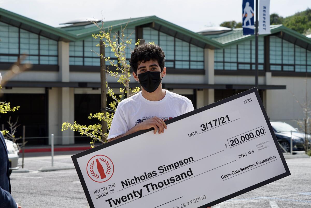 Nick Simpson with his $20,000 college scholarship.