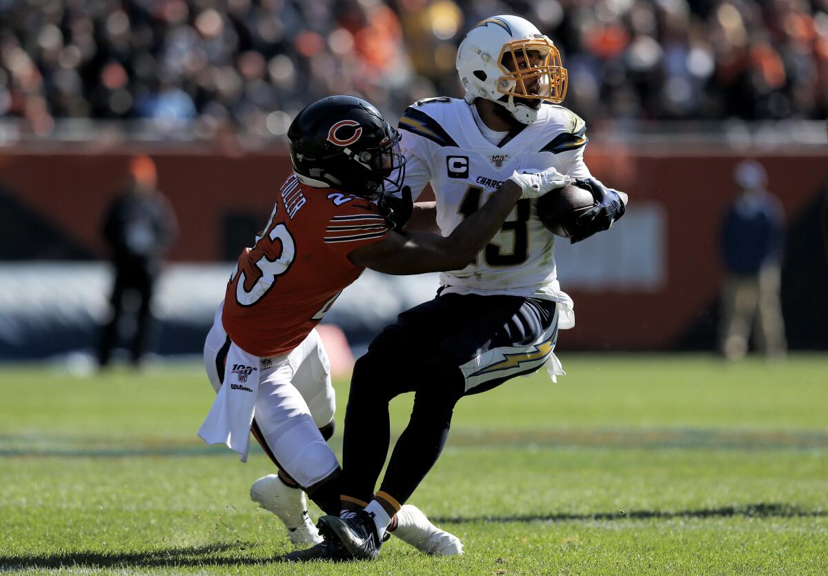 Chargers wide receiver Keenan Allen runs with the ball while being tackled by Chicago Bears cornerback Kyle Fuller during the second quarter of Sunday's 17-16 win.