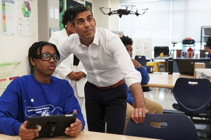 British Prime Minister Rishi Sunak watches a drone demonstration as he visits the Friendship Technology Preparatory High School during his trip to Washington, Wednesday, June 7, 2023. (Kevin Lamarque/Pool Photo via AP)