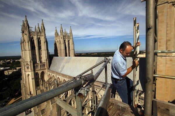 Joe Alonso, the Episcopal cathedral's master stonemason, climbs to a pinnacle on the south transept. The pinnacle rotated several inches in the quake.