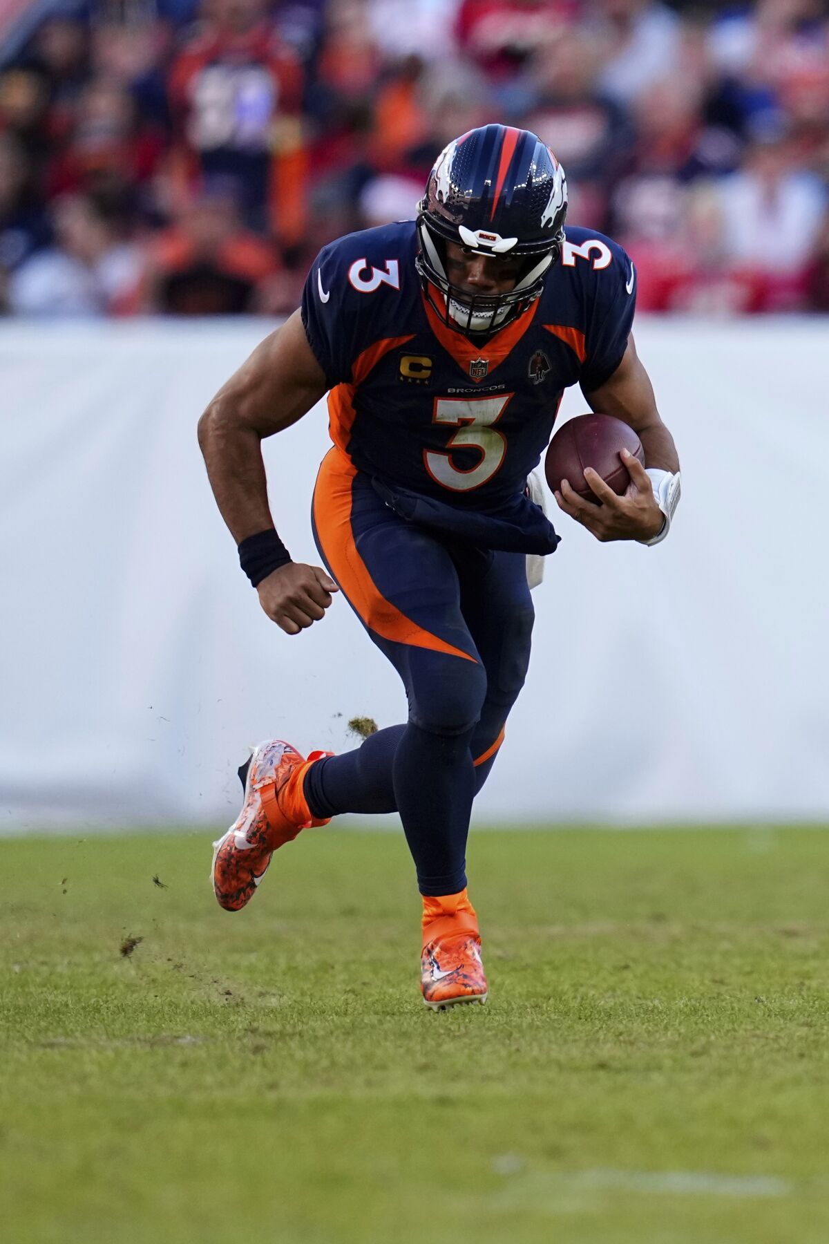 Denver Broncos quarterback Russell Wilson (3) runs against the Kansas City Chiefs.