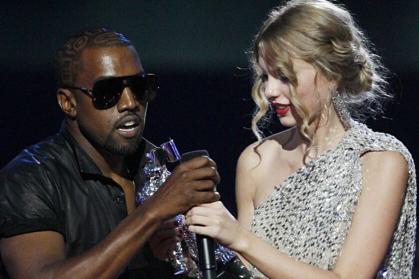 Kanye West and Taylor Swift at the MTV Video Music Awards in 2009, where their feud began.