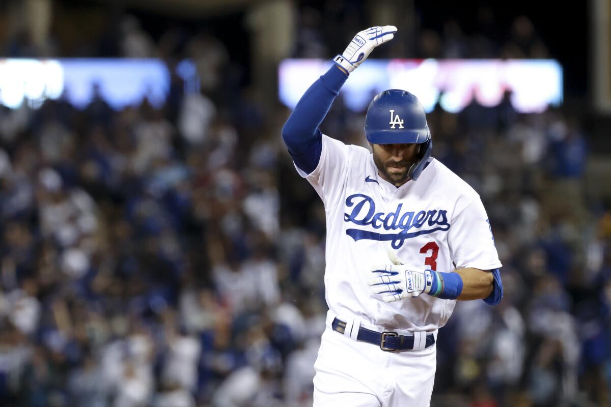 Chris Taylor rounds the bases after hitting a two-run home run during the fifth inning of the Dodgers' 11-2 win.